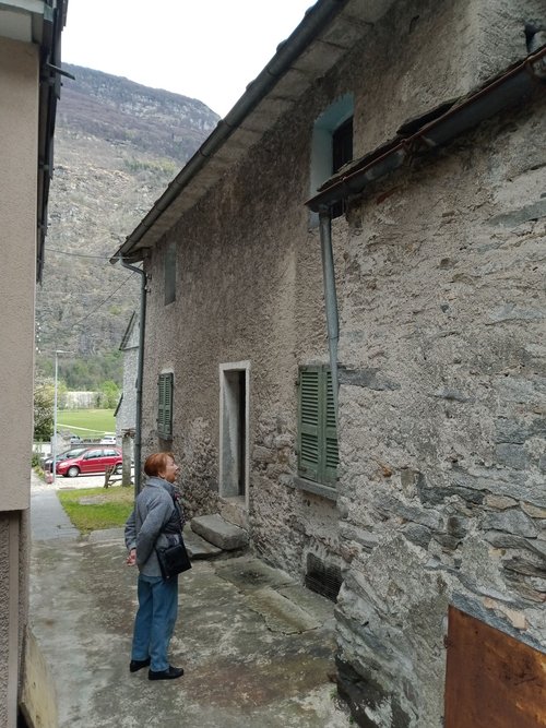 Personico — stone facade with mountain backdrop